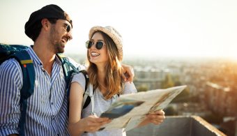 Couple smiling at each other exploring Europe