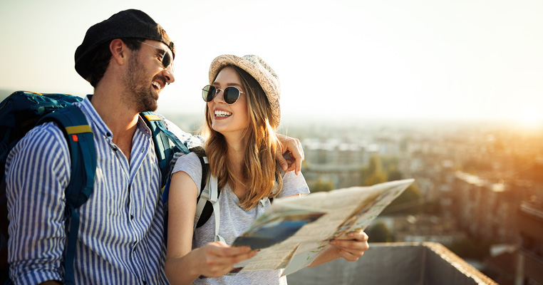 Couple smiling at each other exploring Europe